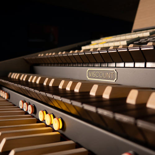 Close-up of a Viscount Cantorum Trio Plus Wood Keys 3 Manual Portable Organ with focus on the brand name