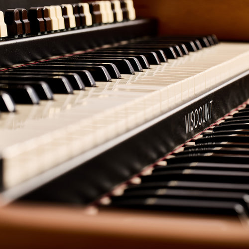 Close-up of the Viscount Legend 261 waterfall keys with the Viscount name on the keybed strip
