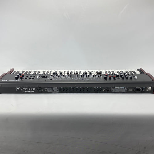 Rear panel of the Viscount Legend One 73 showing the Viscount logo and connection ports including audio outs, pedal jacks, MIDI, USB, and mains power inlet, on a white background.