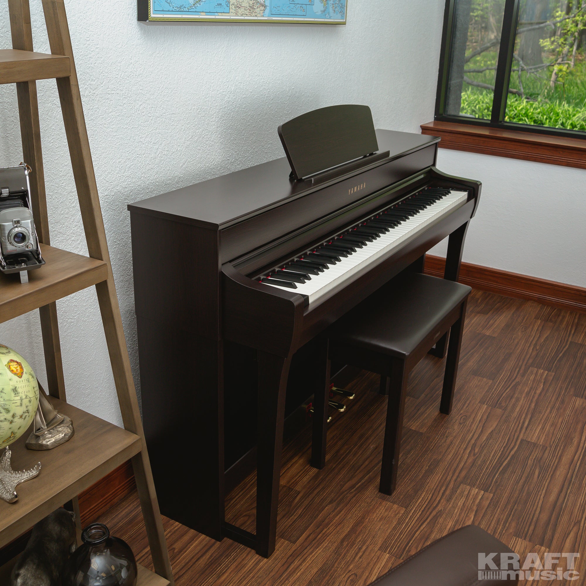 Yamaha Clavinova CLP-735 Digital Piano - Rosewood - right facing in a stylish room