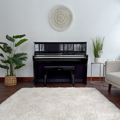 Yamaha Clavinova CSP-295 Digital Piano - Polished Ebony -  in a stylish living room front facing