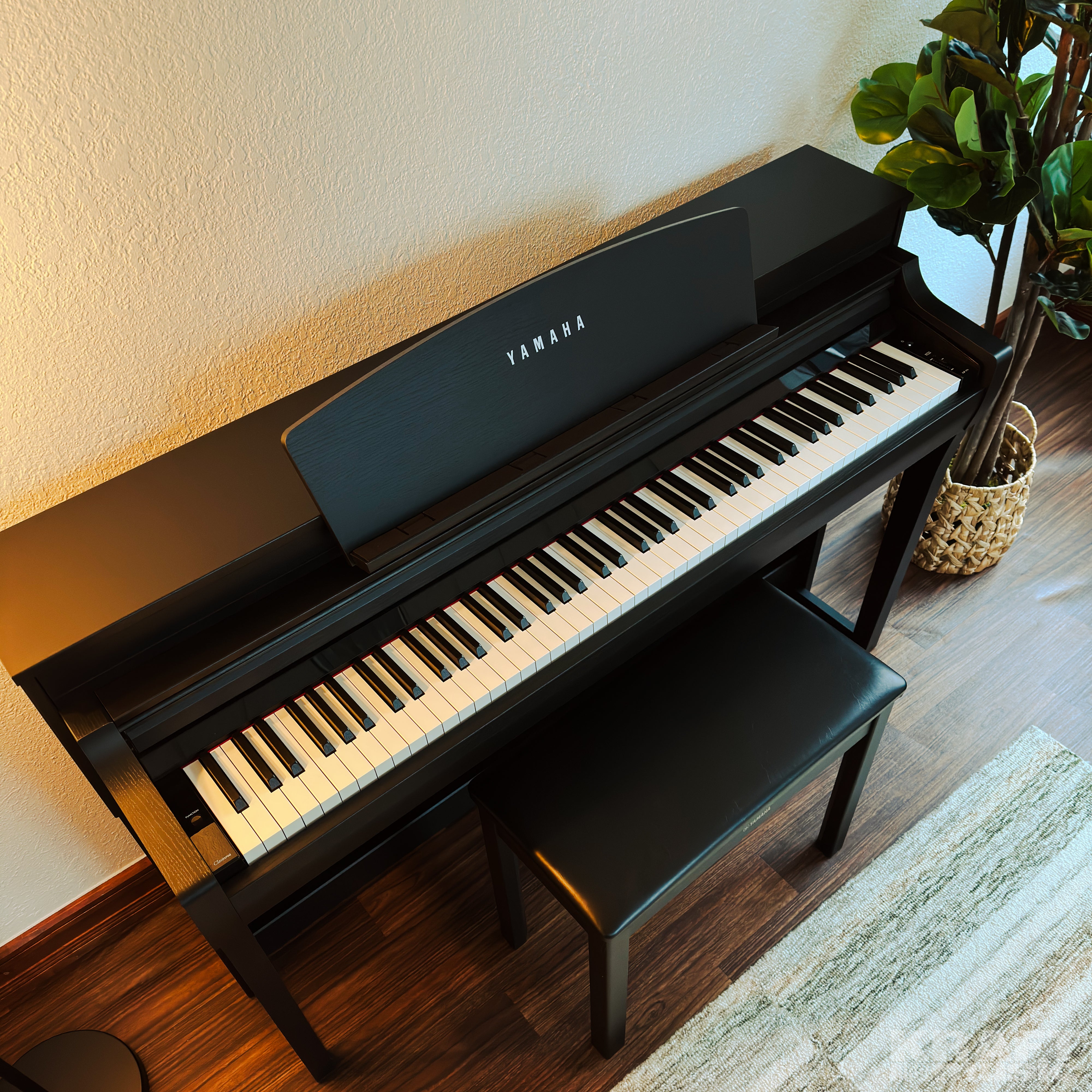 Yamaha Clavinova CSP-275 Digital Piano - Black Walnut - in a stylish living room top view