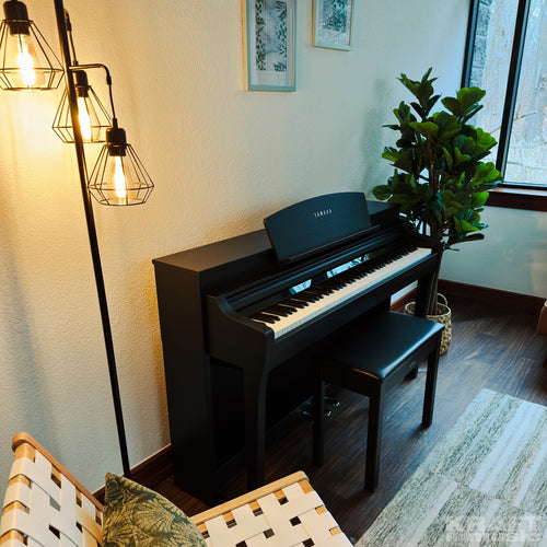 Yamaha Clavinova CSP-275 Digital Piano - Black Walnut - in a stylish living room facing right from above
