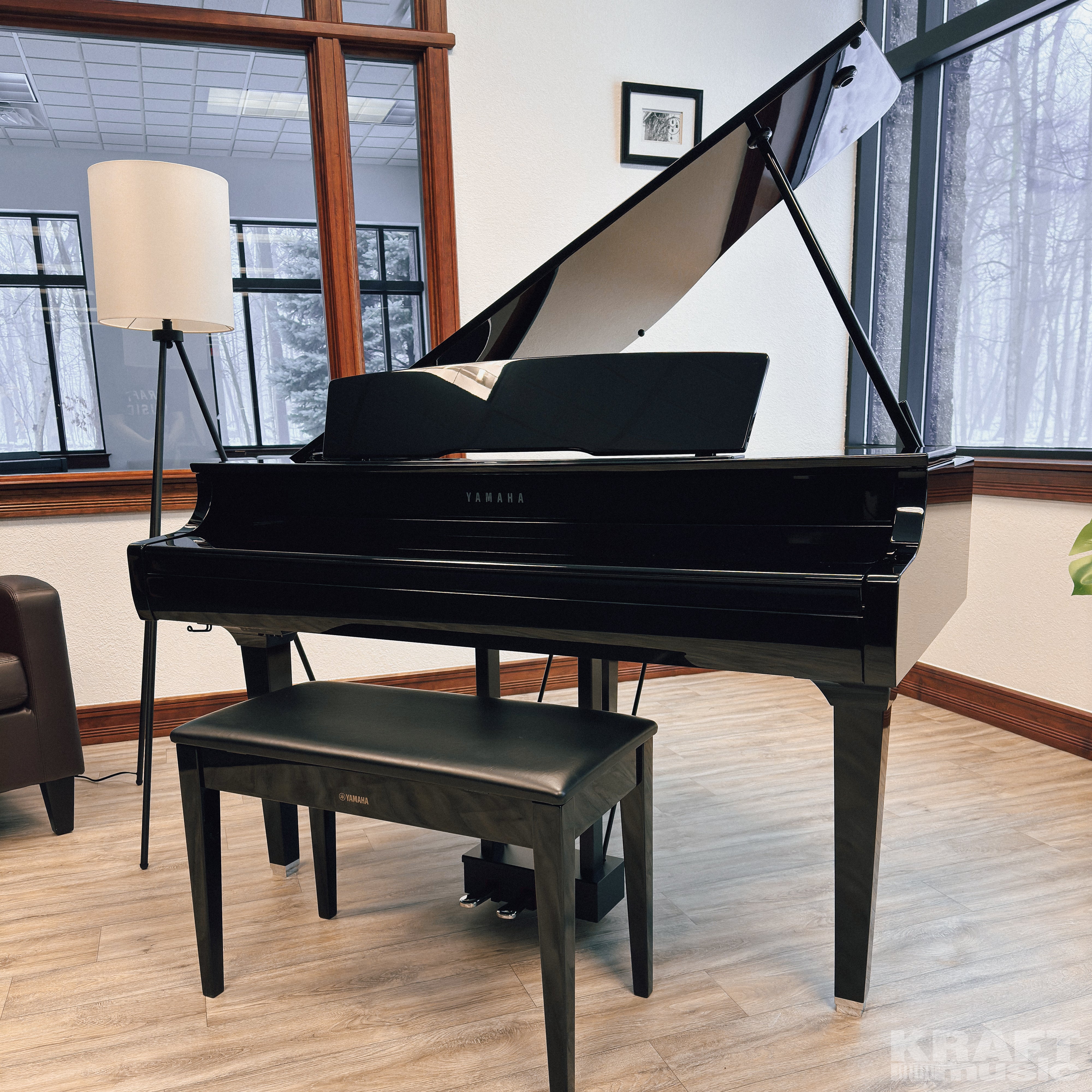 Yamaha Clavinova CSP-295GP Digital Grand Piano - Polished Ebony - in a stylish music room with the key cover closed