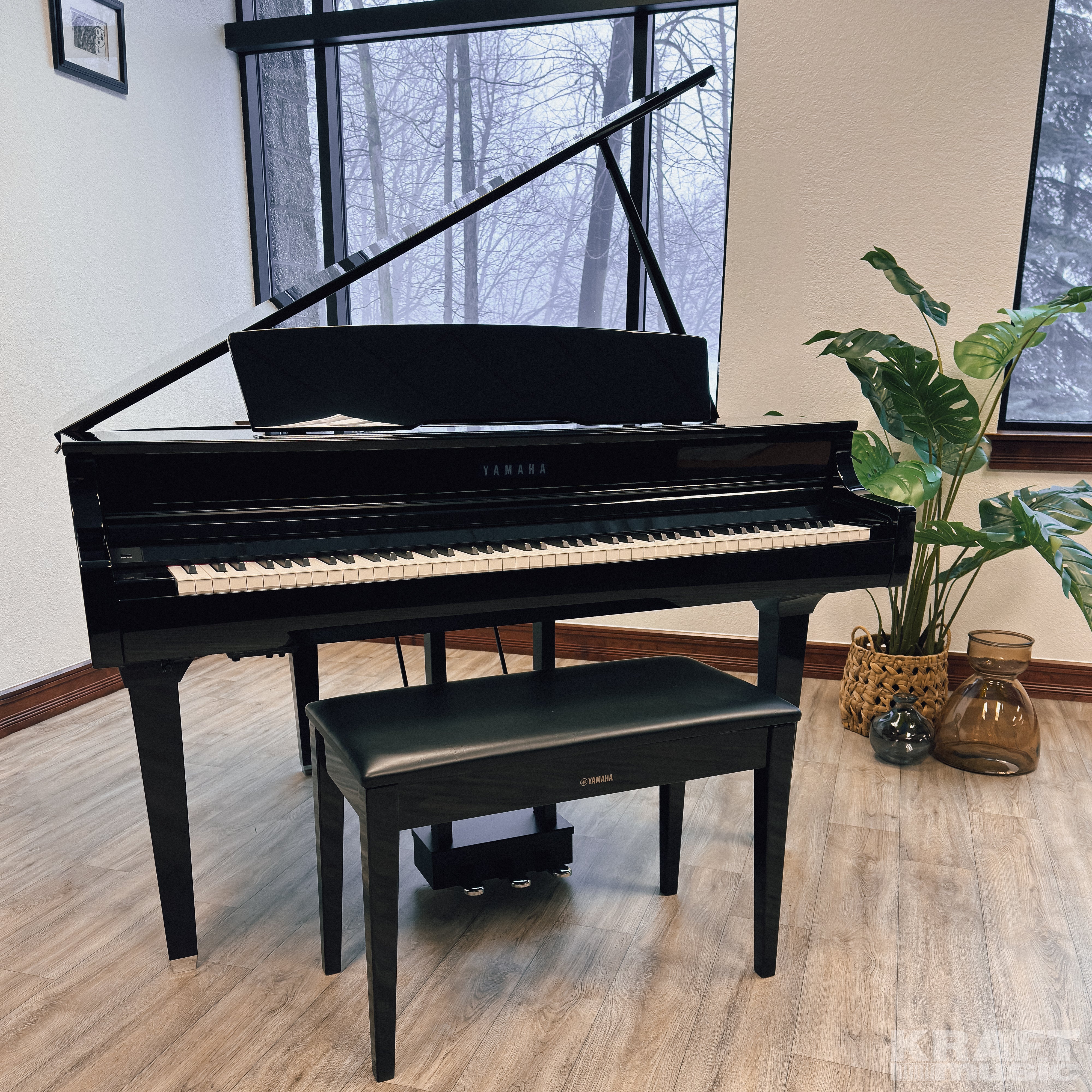 Yamaha Clavinova CSP-295GP Digital Grand Piano - Polished Ebony - in a stylish music room front view