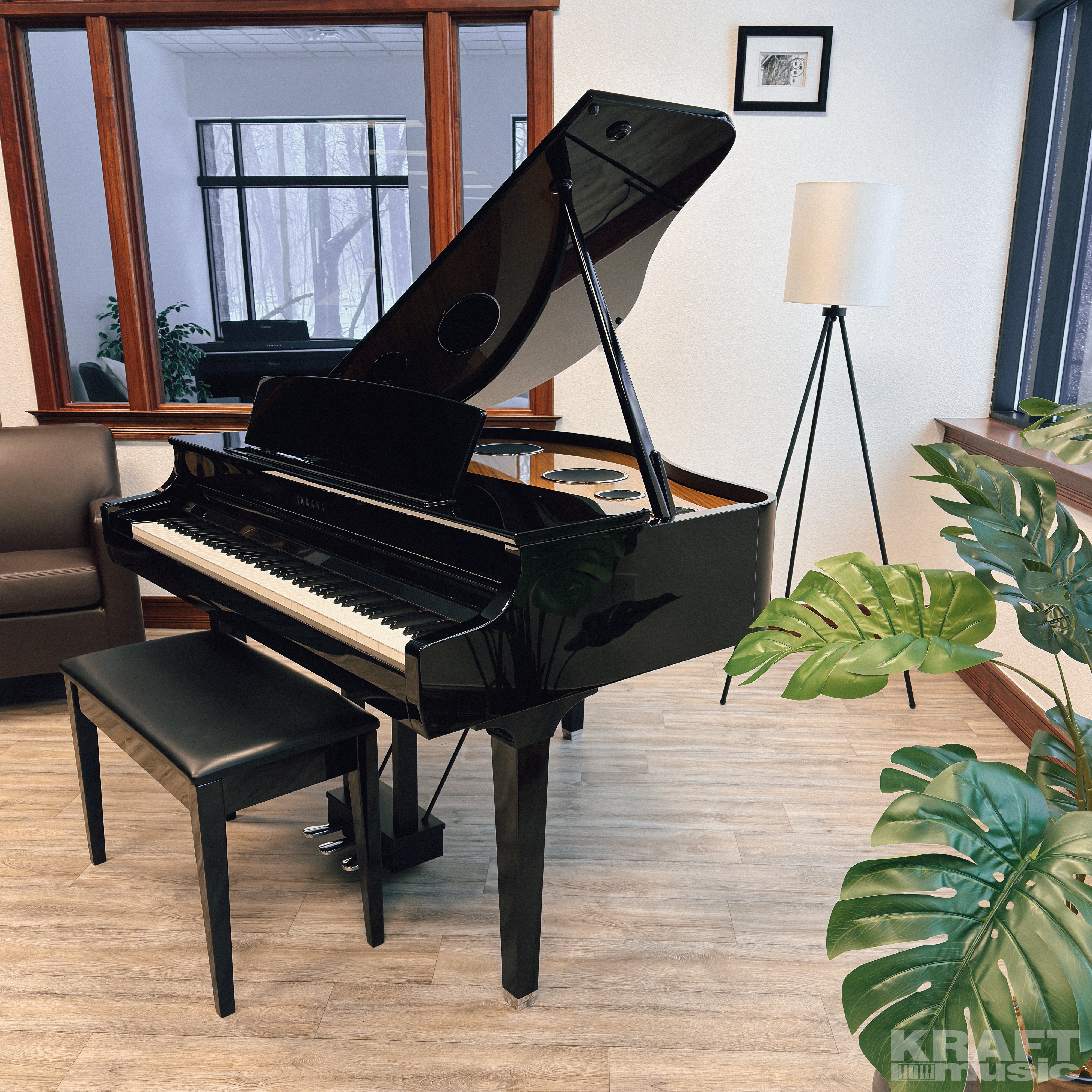 Yamaha Clavinova CSP-295GP Digital Grand Piano - Polished Ebony - in a stylish music room facing left with lid up