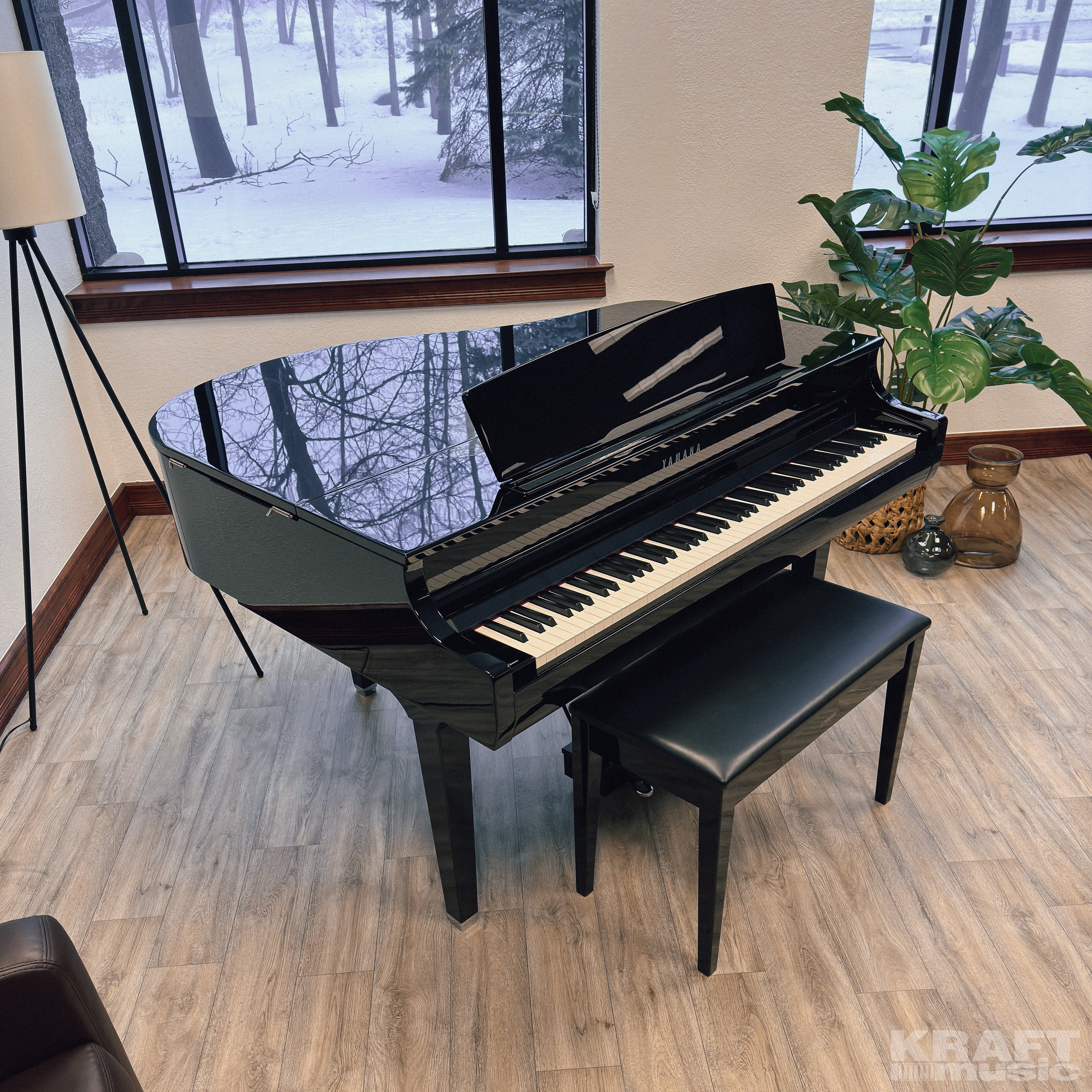 Yamaha Clavinova CSP-295GP Digital Grand Piano - Polished Ebony - in a stylish music room facing right with lid closed from above
