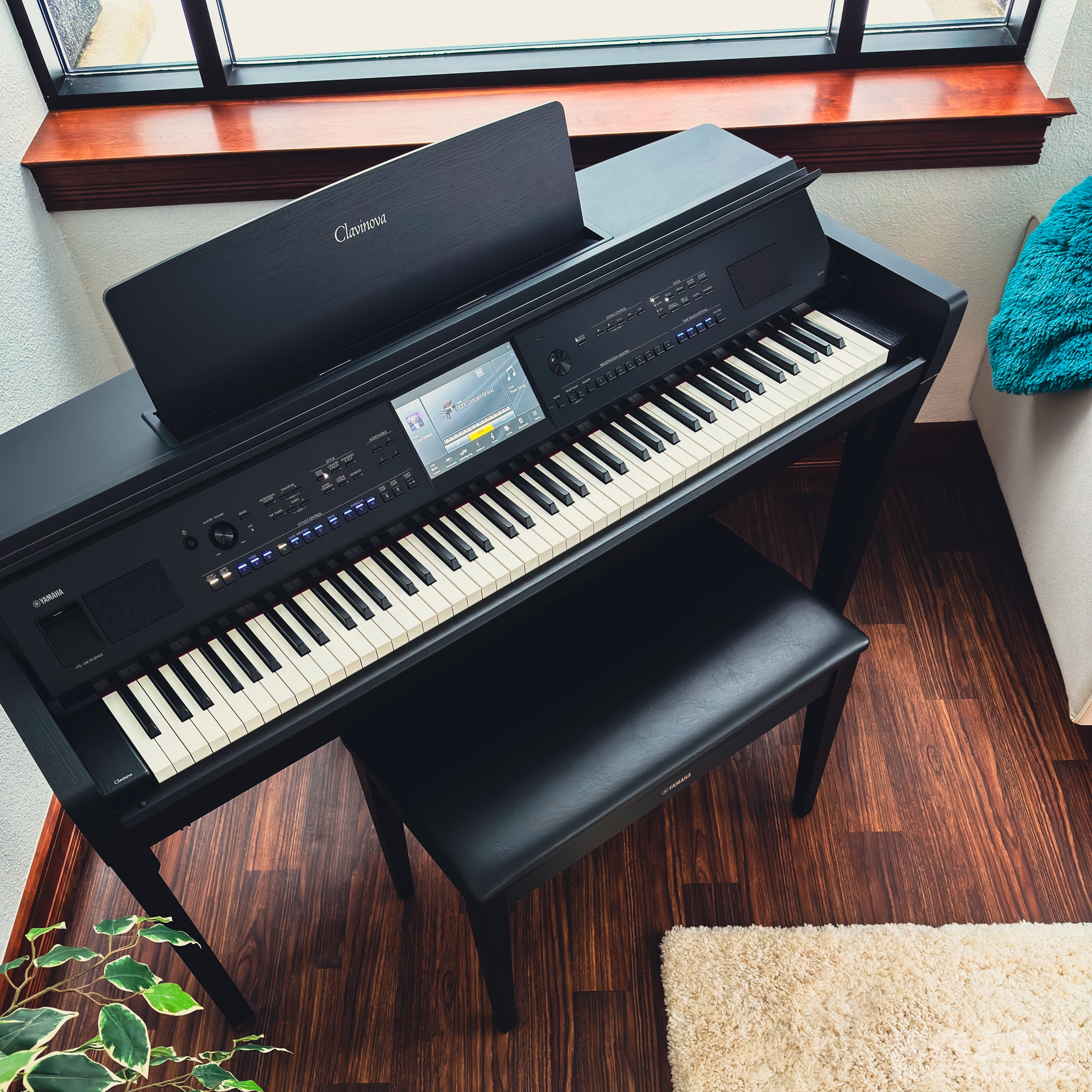 Yamaha Clavinova CVP-909 Digital Piano - Matte Black - in a stylish living room from above