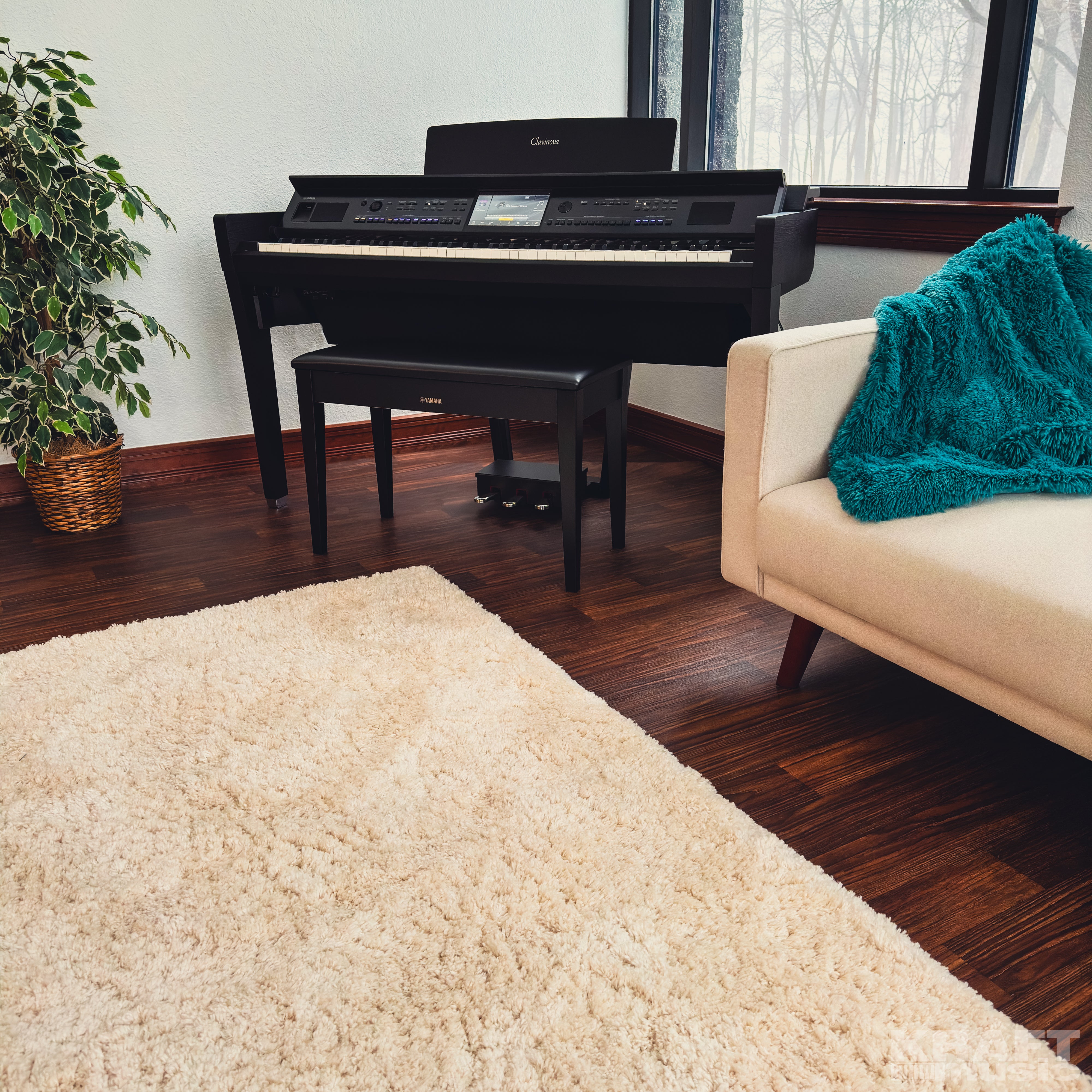 Yamaha Clavinova CVP-909 Digital Piano - Matte Black - in a stylish living room facing left