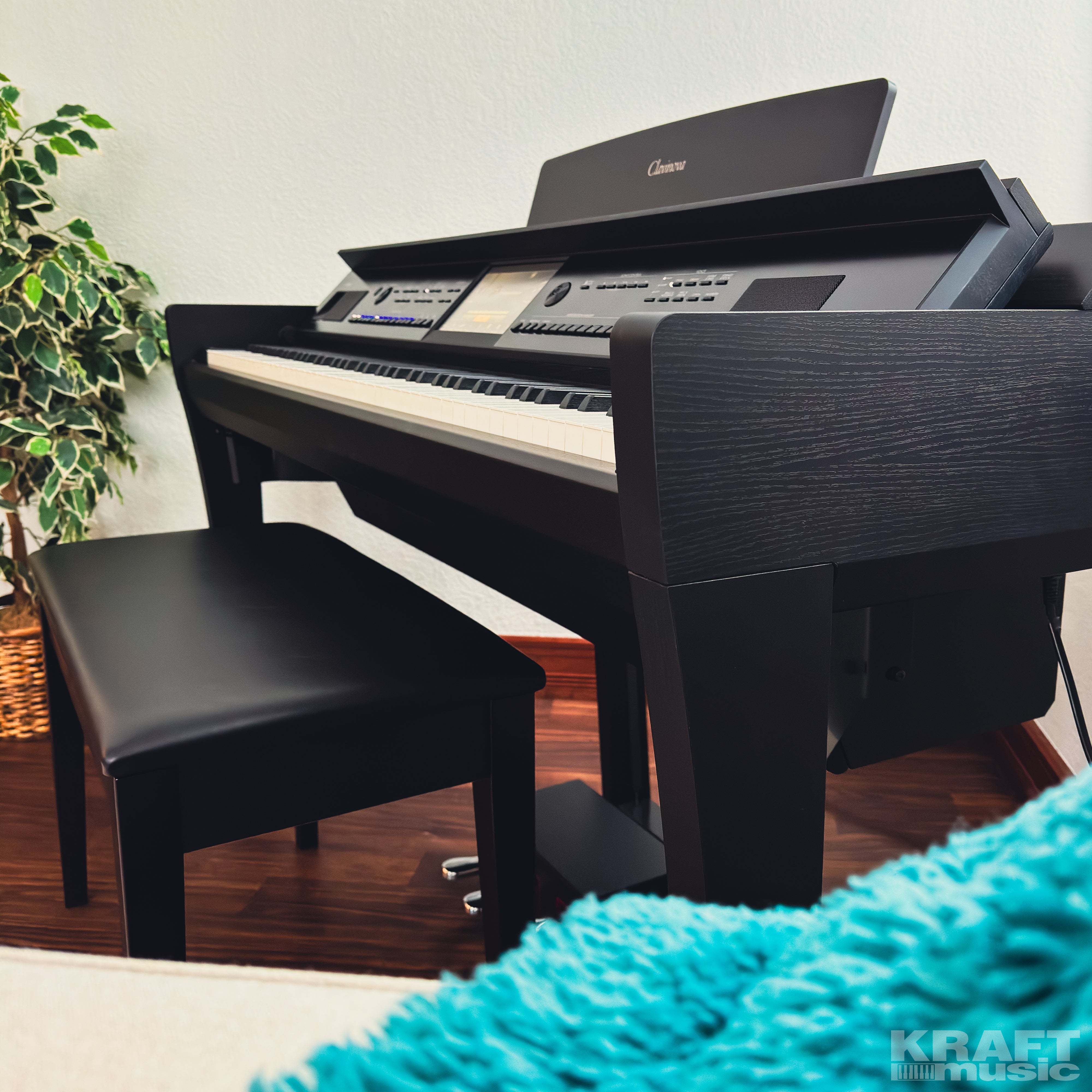 Yamaha Clavinova CVP-909 Digital Piano - Matte Black - in a stylish living room facing left up close