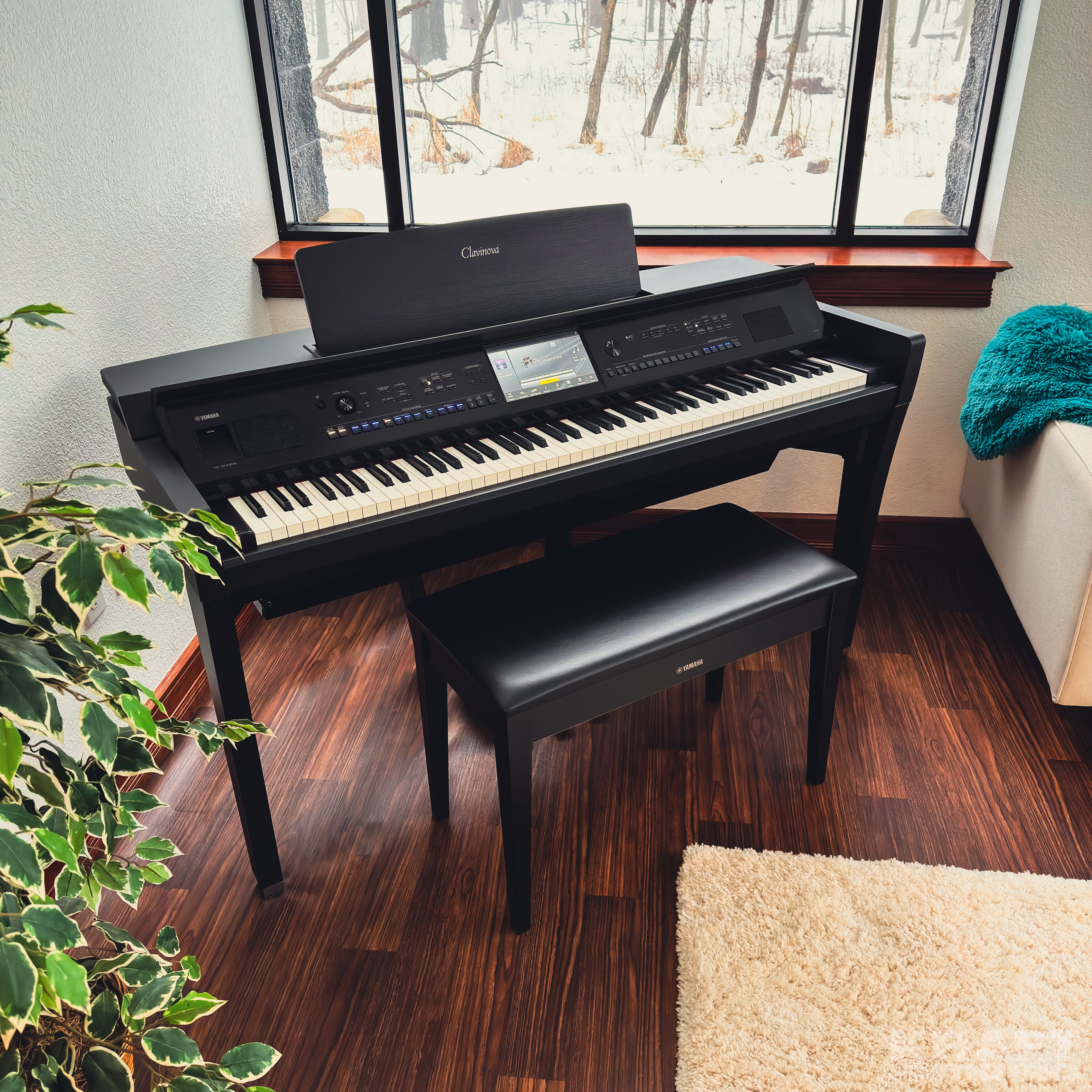 Yamaha Clavinova CVP-909 Digital Piano - Matte Black - in a stylish living room facing right