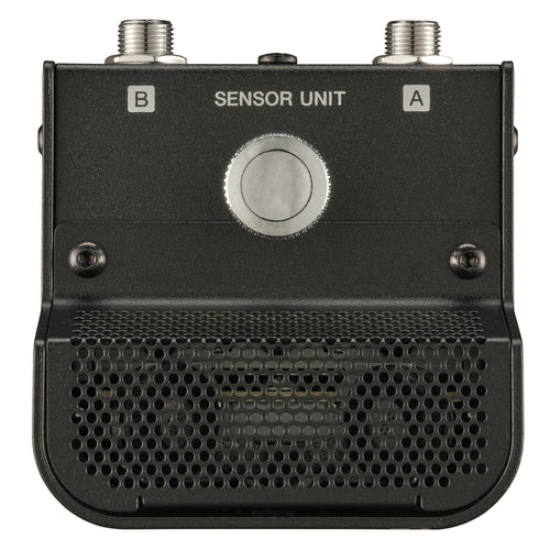 Black metal sensor unit with two threaded connectors labeled A and B, a central round silver button, and a perforated lower grille on a white background.