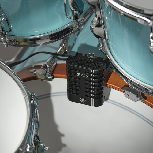 A close-up of the Yamaha EAD20 Electronic Acoustic Drum Module Mic mounted on a wooden drum rim