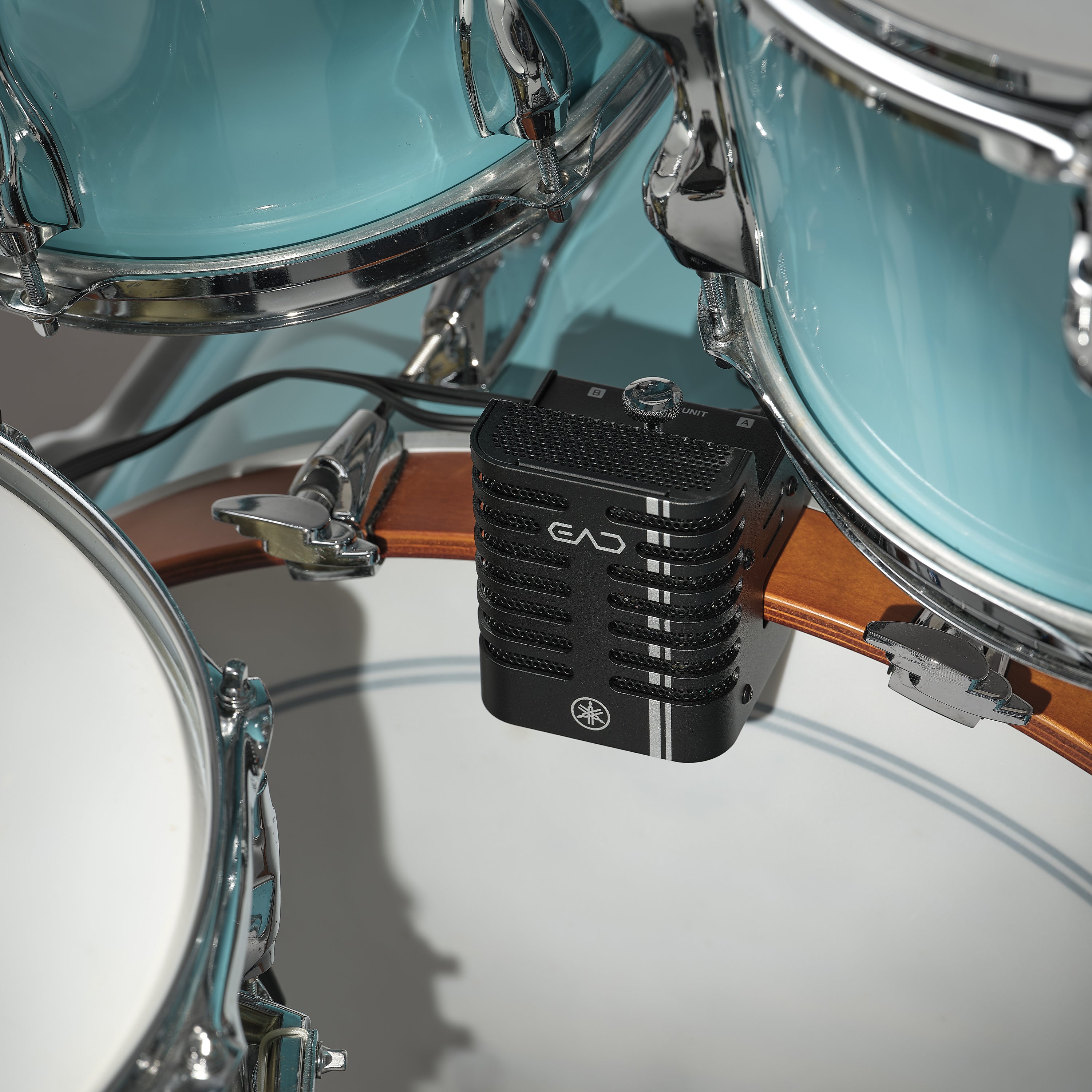 A close-up of the Yamaha EAD20 Electronic Acoustic Drum Module Mic mounted on a wooden drum rim