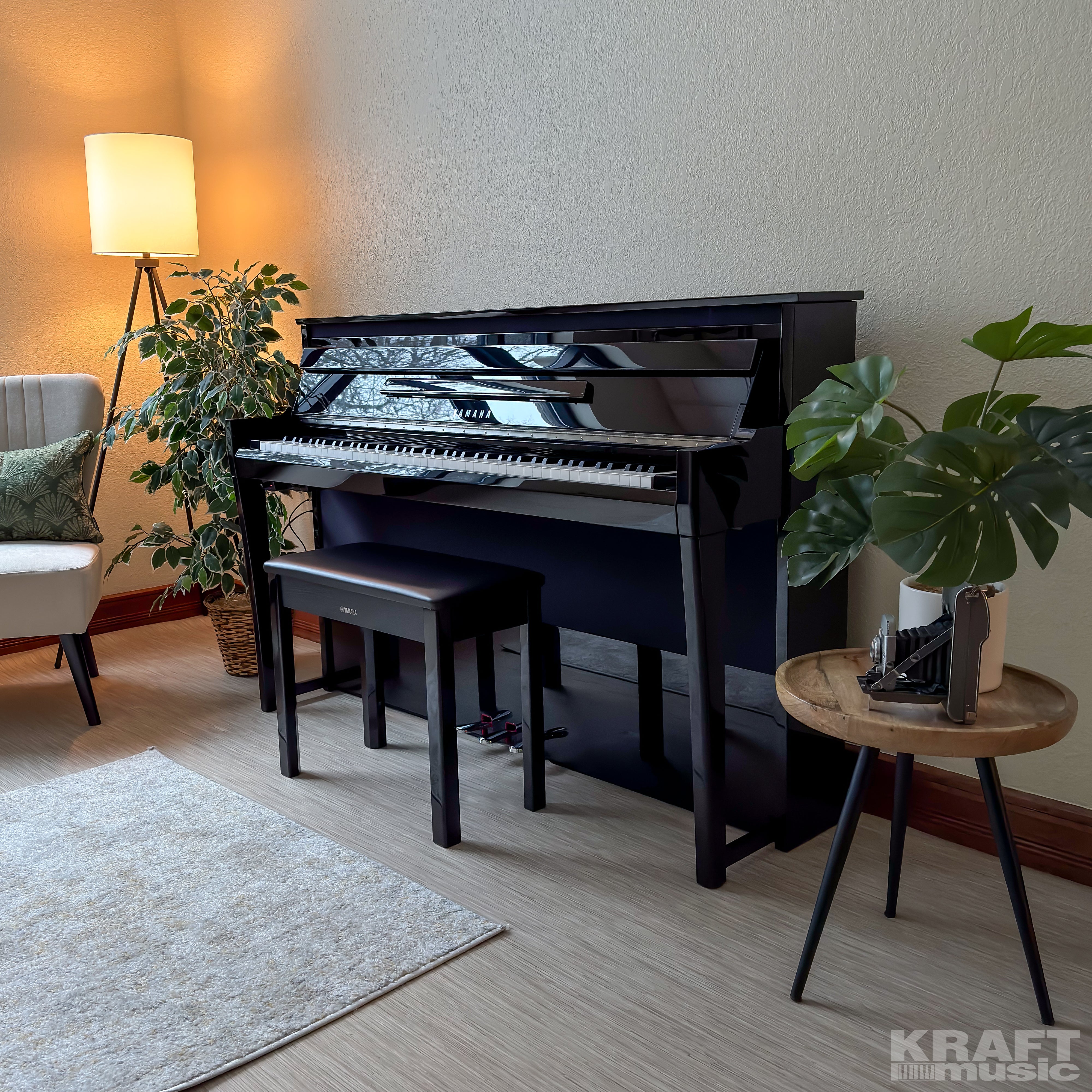 Yamaha AvantGrand NU1XA Hybrid Piano - Polished Ebony - left facing in a stylish living space