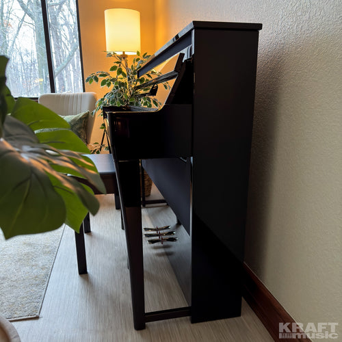 Yamaha AvantGrand NU1XA Hybrid Piano - Polished Ebony - side view in a stylish living space