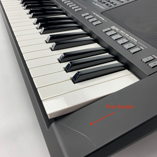 fine scratch on right end of keyboard housing