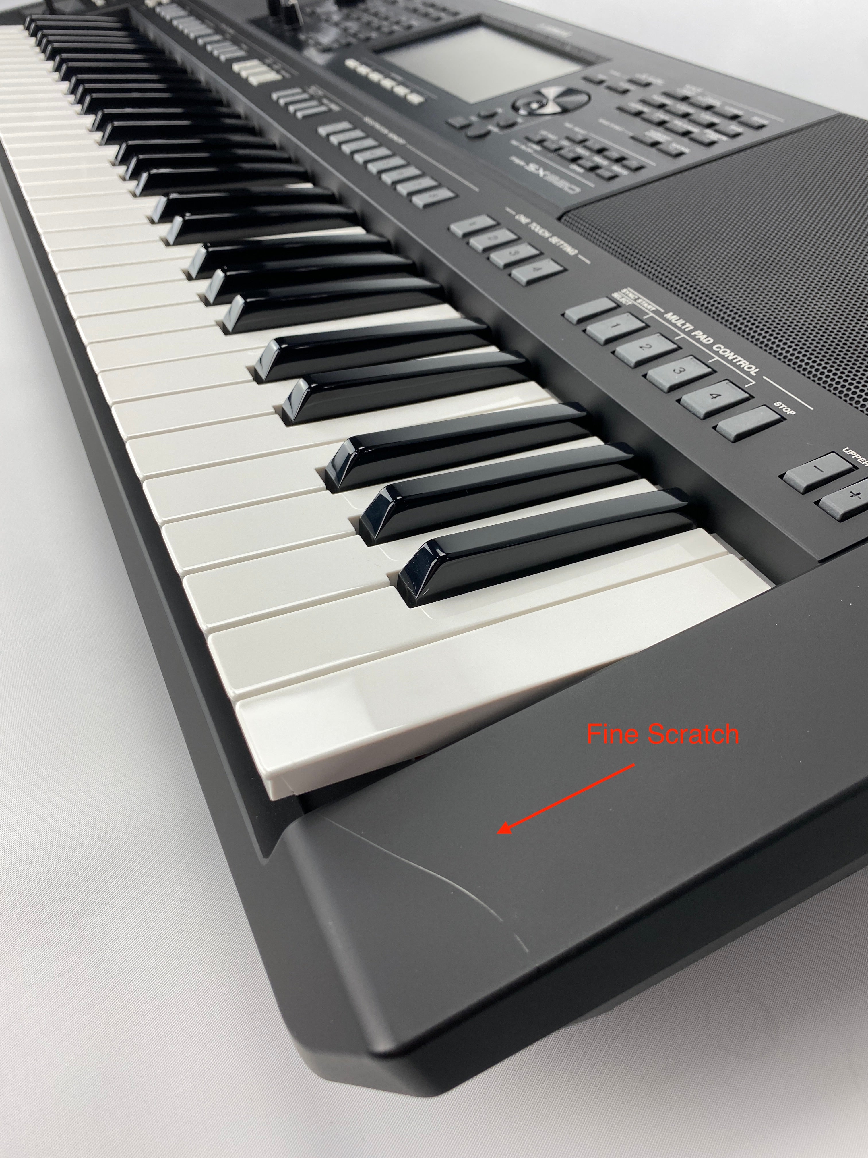fine scratch on right end of keyboard housing