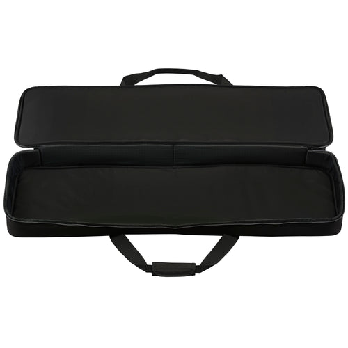 Open, empty case: Yamaha SCDE76 soft case unzipped and open, showing the padded black interior lining and carry handles