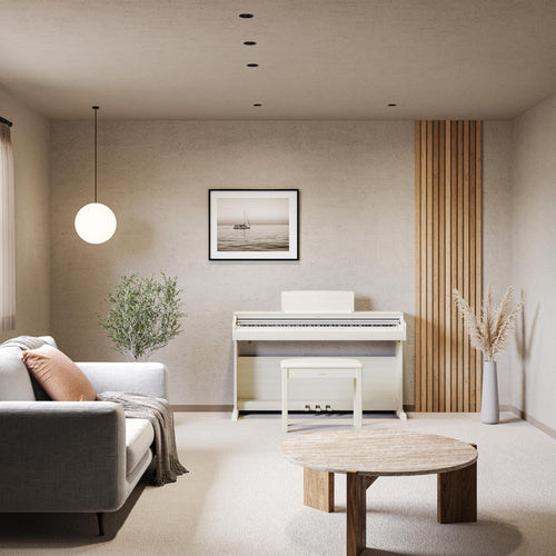 Modern living room with a piano, sofa, and decor elements.