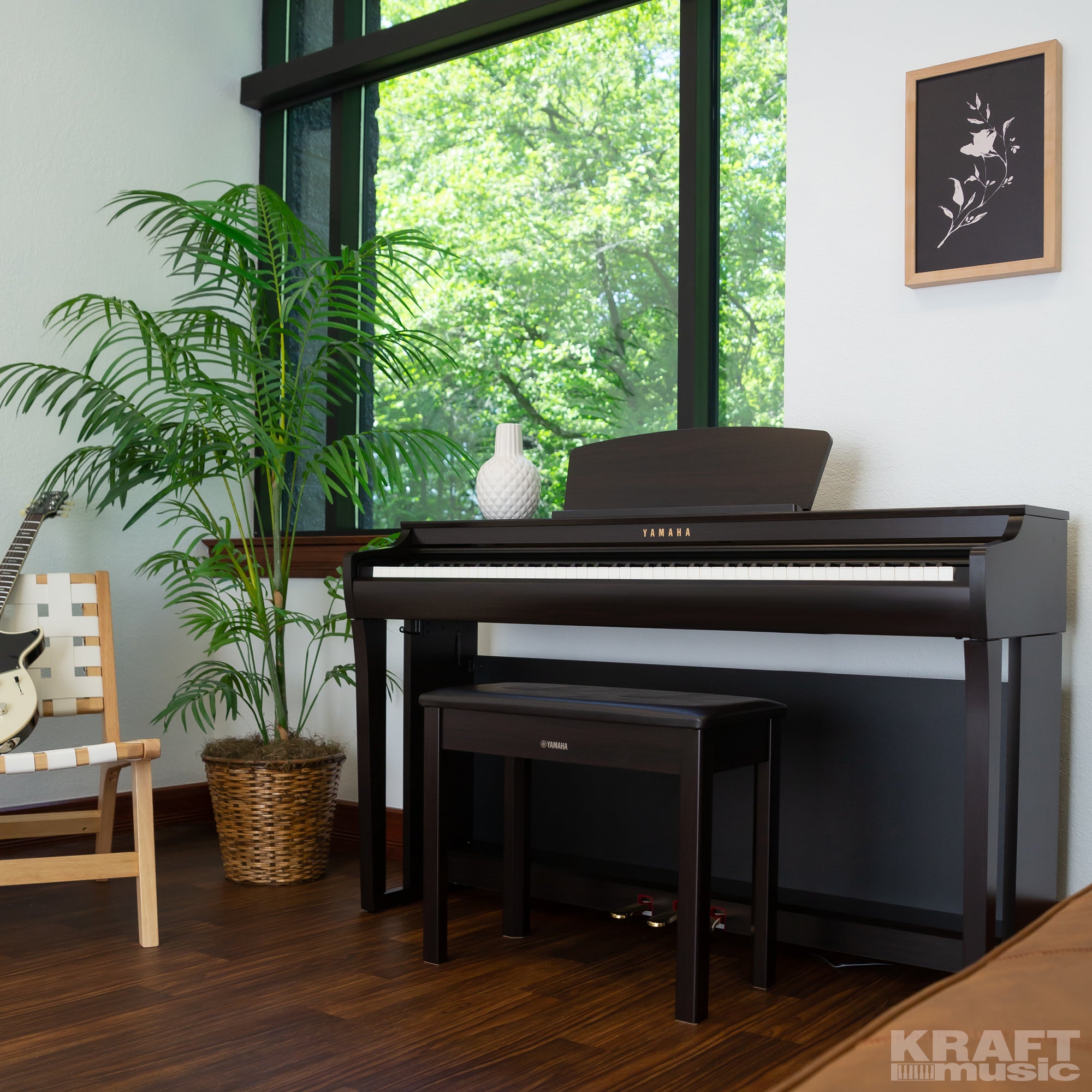 Yamaha Clavinova CLP-725 Digital Piano - Rosewood - left facing in a stylish living room