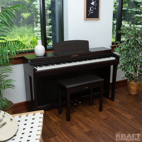 Yamaha Clavinova CLP-725 Digital Piano - Rosewood - right facing in a stylish room