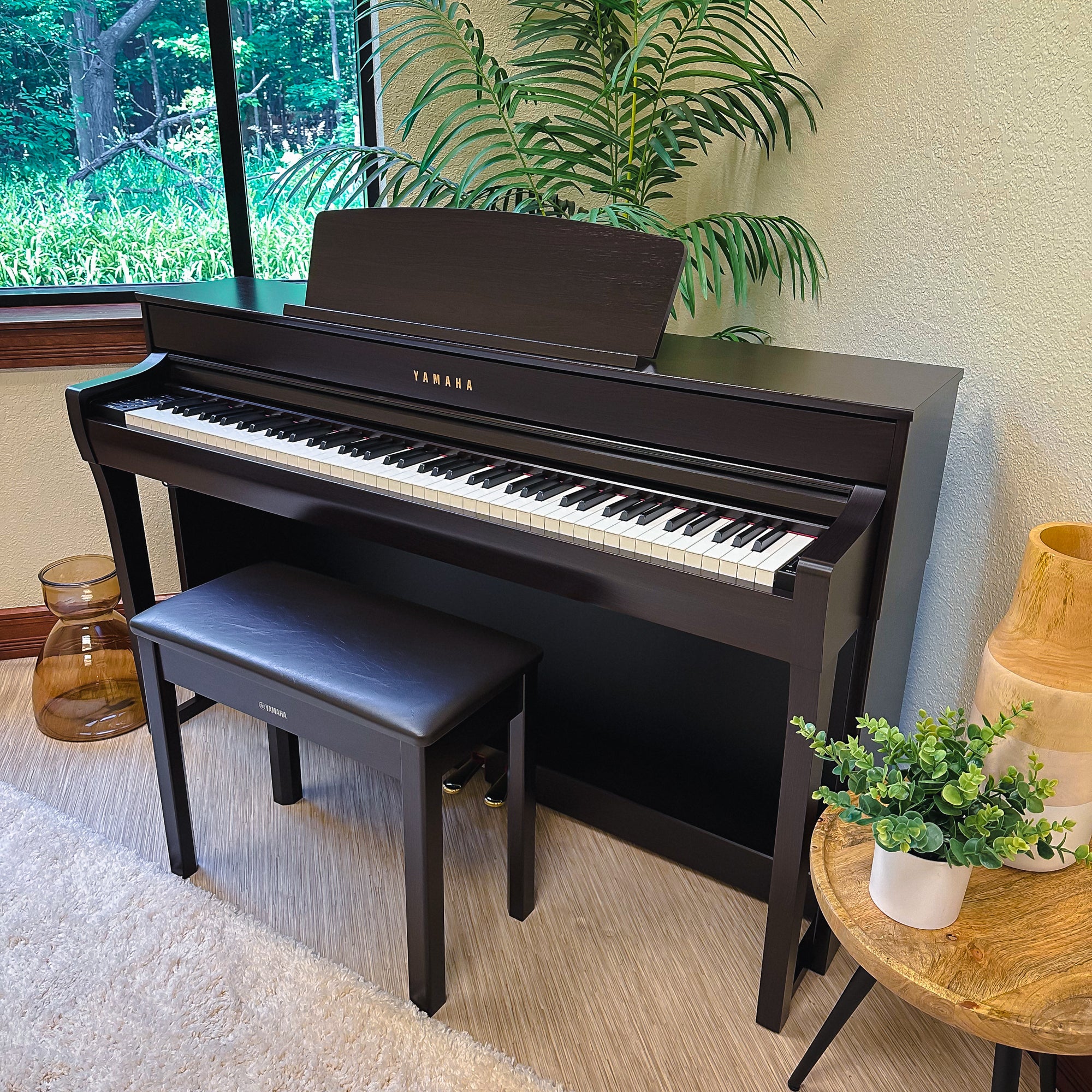 Yamaha Clavinova CLP-745 Digital Piano - Rosewood - left facing in a stylish room