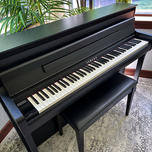 Yamaha Clavinova CLP-885 Digital Piano - Matte Black in a stylish room, view 4