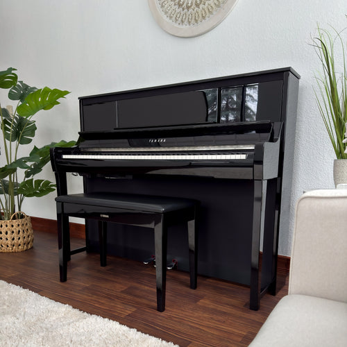 Yamaha Clavinova CSP-295 Digital Piano - Polished Ebony - left facing in a stylish living room