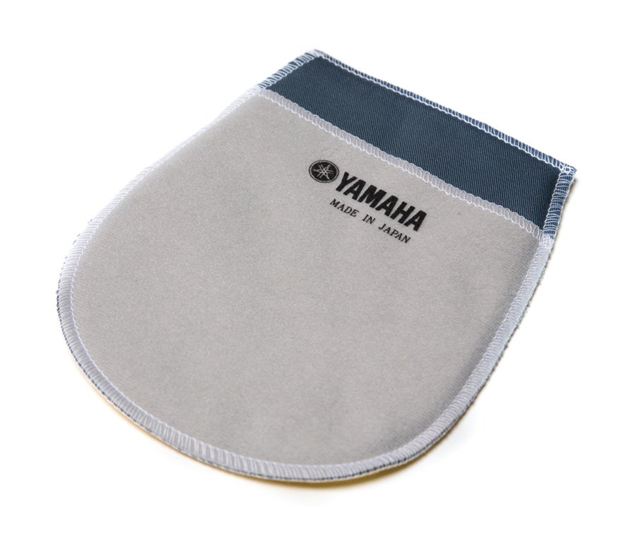Grey and navy blue Yamaha piano polishing mitt with overlocked edges and a printed Yamaha logo with "Made in Japan" text, on a white background.