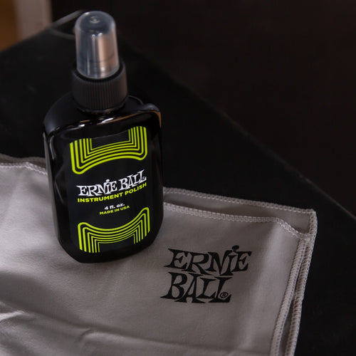 Style shot of the Main image of Ernie Ball Guitar Polish with Polishing Cloth unboxed