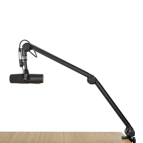 Image of the Gator Frameworks Deluxe Desktop Mic Boom Stand attached to a desk 