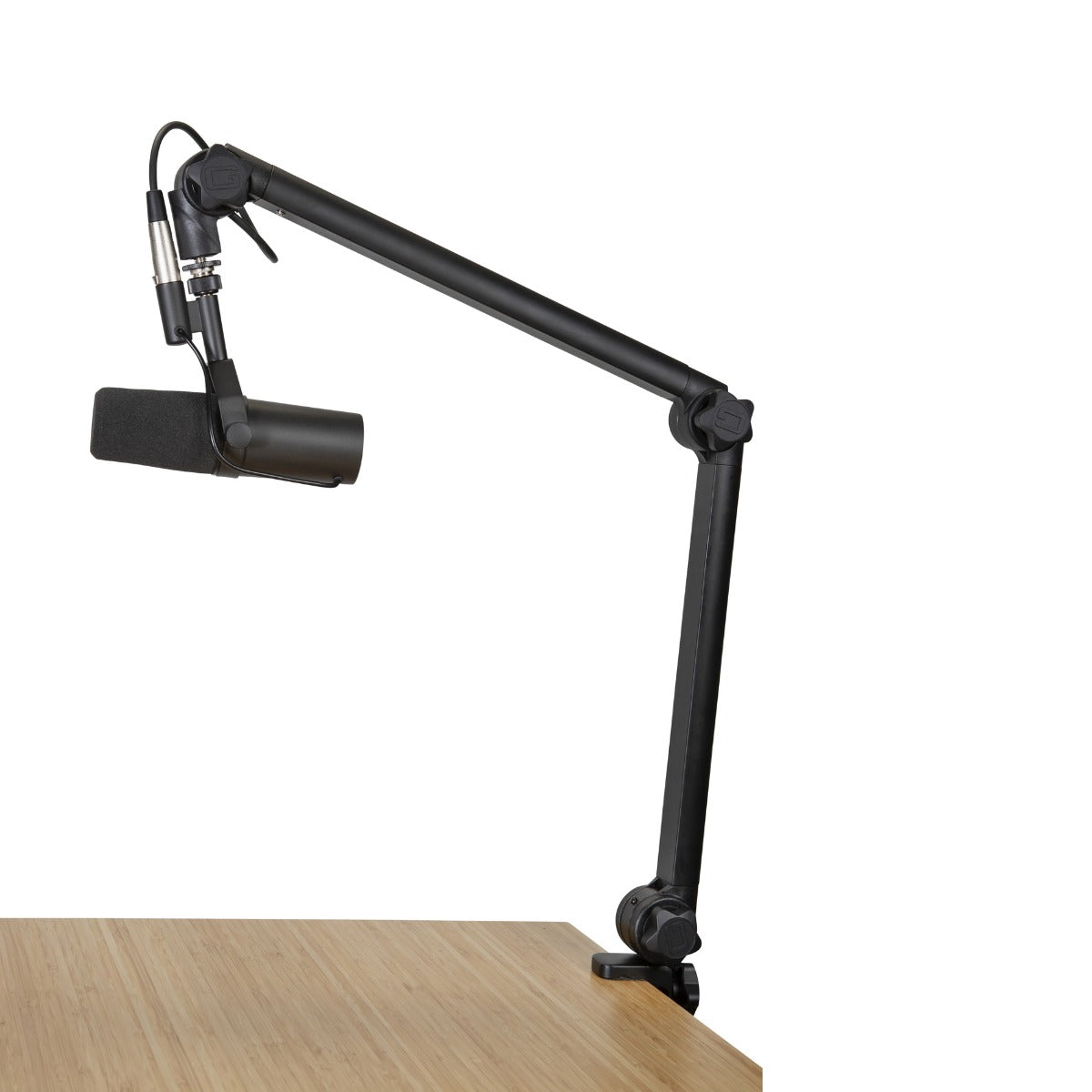 Image of the Gator Frameworks Deluxe Desktop Mic Boom Stand attached to a desk