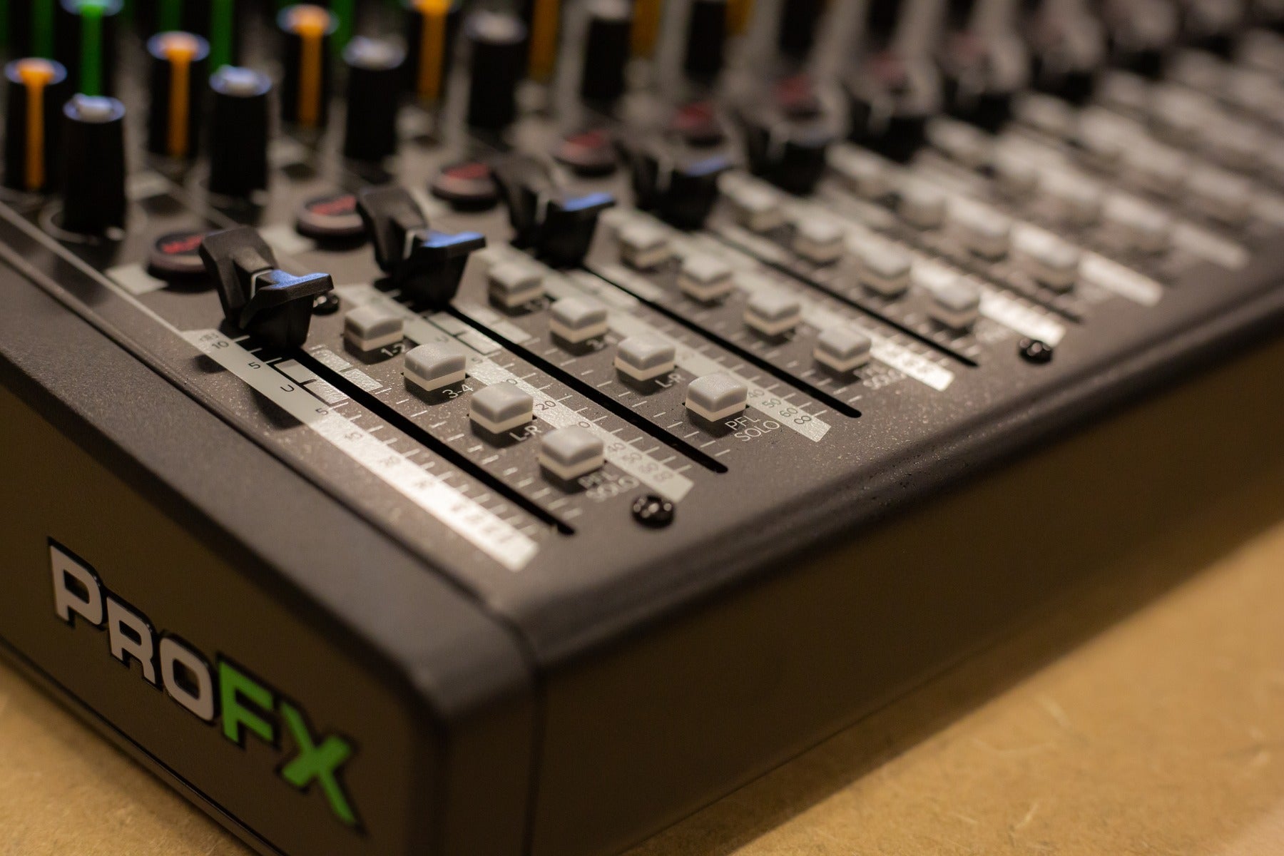 Close up view of the faders for the Mackie ProFX16v3 Effects Mixer with USB