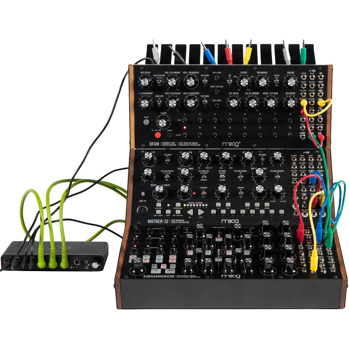 Close-up image of Moog Sound Studio - Mother-32, Subharmonicon & DFAM Analog Synthesizer Bundle showing Mother-32 and DFAM in 2-Tier Rack Kit with cable organizer attached alongside summing mixer with power, audio and patch cables connected