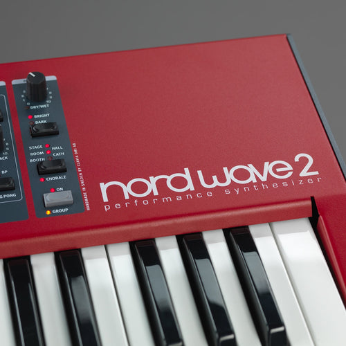 Detail closeup of Nord Wave 2 61-Key Performance Synthesizer showing logo, keybed and control panel