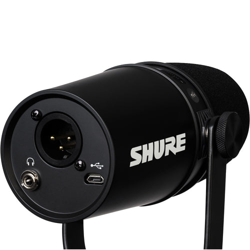 3/4 view of Shure MV7 Podcast Microphone - Black with integrated yoke in stand position showing rear, top and left side