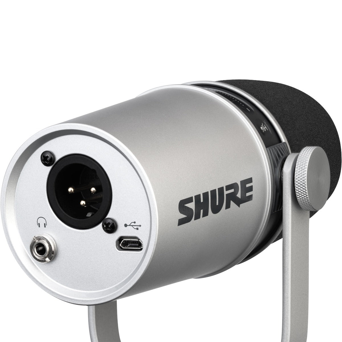 3/4 view of Shure MV7 Podcast Microphone - Silver with integrated yoke in stand position showing rear, top and left side