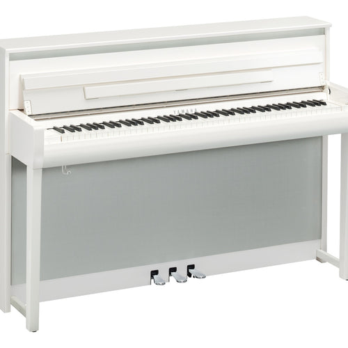 3/4 view of Yamaha Clavinova CLP-785 Digital Piano - Polished White showing front, top and left side
