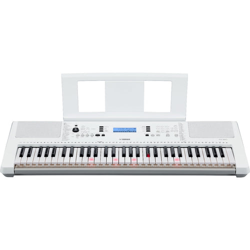 Perspective view of Yamaha EZ-300 Portable Keyboard with music rest attached showing top and front