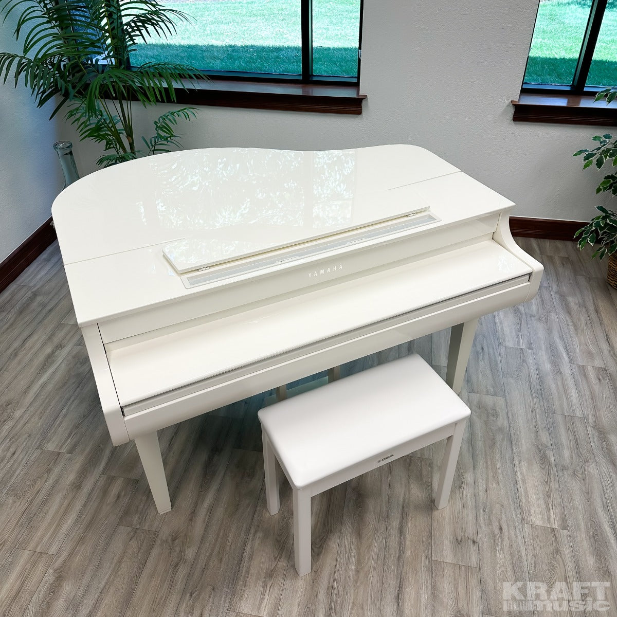 Yamaha Clavinova CLP-765GP Digital Piano - Polished White - Lid and key cover closed and music rest down view 2