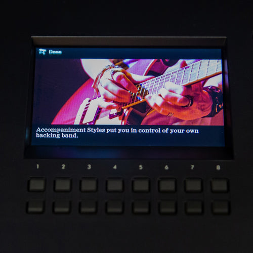 Close up of the Yamaha DGX-670 control panel showing the accompaniment styles option on the screen